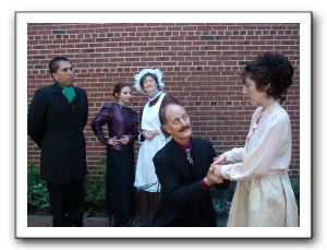 Mr. Manningham (Bill Kitzerow) glares at Rough (James McDaniel) while Rough consoles Mrs. Manningham (Katherine Bisulca) as their 2 maids, Nancy (Rebe