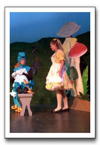 Chris Dong as Caterpillar and Cassie Youhouse as Alice