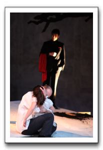 Sydney Maloney (Josie Kilbride) is held by Ryan Tumulty (as her father, Cathage Kilbride), with Zachary Fernebok (the Ghost Fancier), looking on