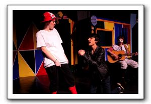 Morgaine Gooding-Silverwood as Isabella/Fabricio, Alec Aziz as Orazio and Sam Stone as Minstrel Zanni