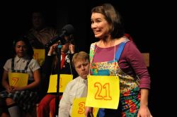 Spelling Bee contestant Olive (played by Chrissy Barnett Miller) takes her turn. Also pictured, Kim Frias, Alden Michels, Katrina Janson,and Doe Kim.