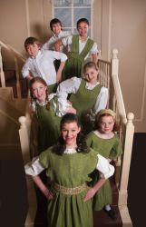 The Von Trapp Family children from front to back: Kimberly Geipel, Jamie Unrath, Brooke Miller, Rachel Rollins, Tommy Richman, Lexi Frilles, and David Capen