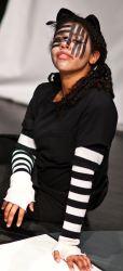 Felicia Clinton as The Cheshire Cat