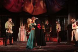(Center) Janie Brookshire as Desdemona and Owiso Odera as Othello with the cast of Shakespeare's Othello