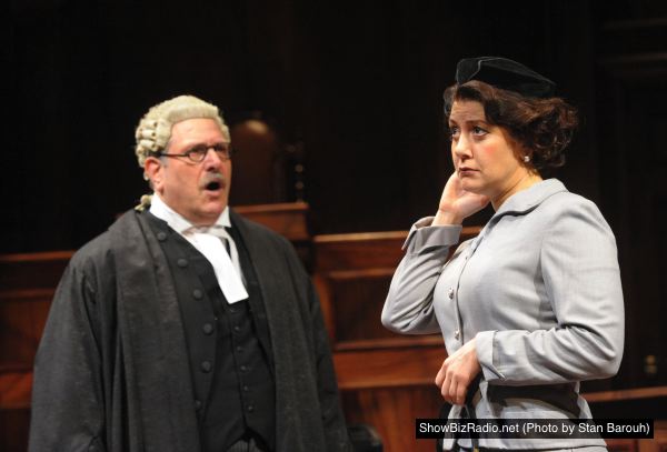 Bob Ari as Sir Wilfrid Robarts and Andrea Cirie as Romaine