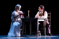 Katrina Van Tassel (Whitney Bashor) is introduced to a forbidden book from her new friend Ichabod Crane (Sam Ludwig)