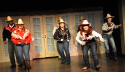 Chrissy Barnett Miller (Jolene) and the ensemble singing 'Oklahoma'