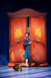 Lucy (Justine Moral) exits the Wardrobe