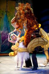 Aslan (puppeteers Michael John Casey, Betsy Rosen, Tracy Ramsay) fights the White Witch (Morgann Rose)
