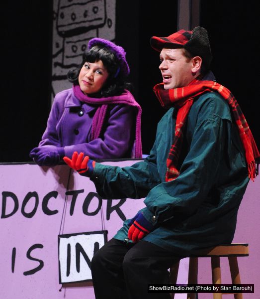 The doctor's in! Lucy (Janine Sunday) helps Charlie Brown (Zack Colonna) work through some of his 'issues'