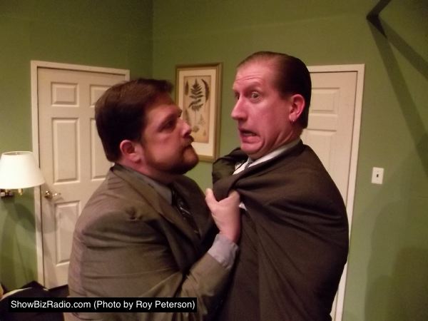 Mob hit man Todd (Jim Adams) and Agent Frank (Eric Small) security guard for the Mayor have a tense moment.