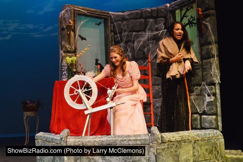 Evilina (Brandi Moore) tricks Princess Briar Rose (Maggie Keane) with the curse of the spinning wheel