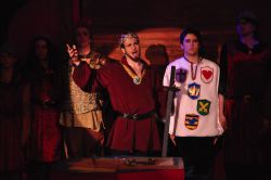 Charlemagne (Robert Schepis) sings 'War is a Science' while his son Pippin (Chris Naughton) and others listen attentively