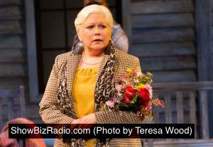 The Woman with Flowers (Florence Lacey) anticipates the return of her estranged daughter