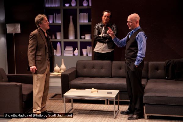 Michael Russotto (center, as Yvan) looks on as John Lescault (left, as Serge) and Mitchell Hébert (right, as Marc) go at it.