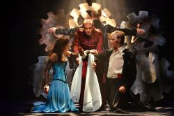 Natalie Berk as Juliet, Irakli Kavsadze as the Friar, and Alex Mills as Romeo
